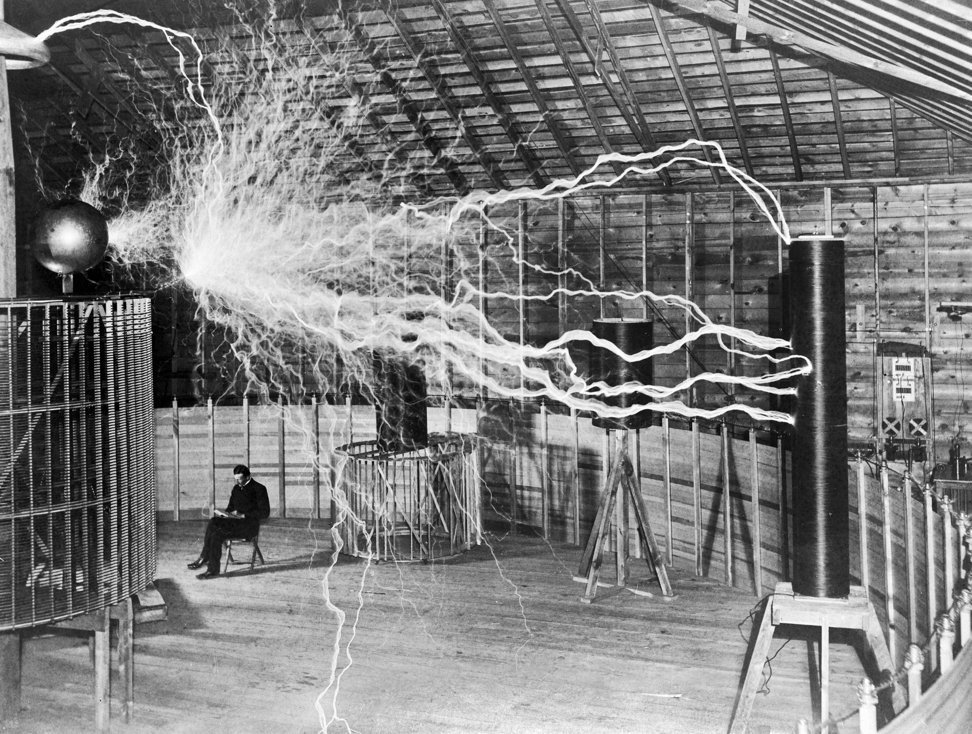 Nikola_Tesla-_with_his_equipment_EDIT-1